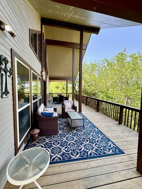 wooden deck with an outdoor hangout area