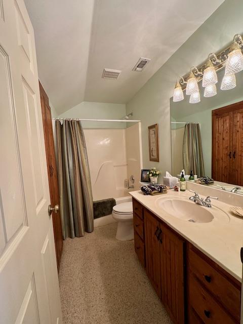 full bath featuring toilet, shower / bath combo, visible vents, and vanity