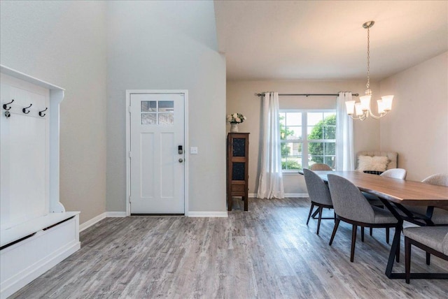 125 Groesbeck Ln, Leander, TX 78641 - dining area featuring a chandelier, wood finished floors, and baseboards