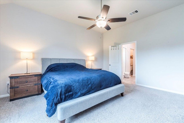 carpeted bedroom featuring connected bathroom, visible vents, baseboards, and a ceiling fan