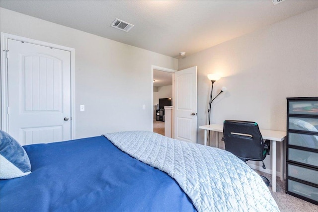 carpeted bedroom with baseboards and visible vents