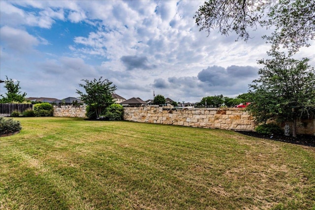 view of yard featuring fence