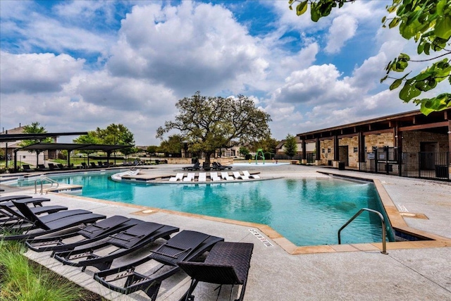 community pool with a patio