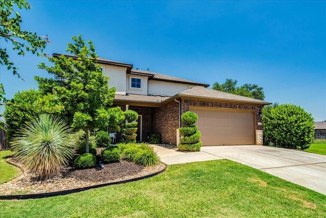 125 Groesbeck Ln, Leander, TX 78641 - view of front facade with driveway, a garage, a front lawn, and brick siding