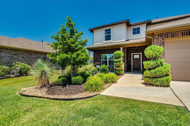 125 Groesbeck Ln, Leander, TX 78641 - view of front of home with brick siding, stucco siding, and a front lawn
