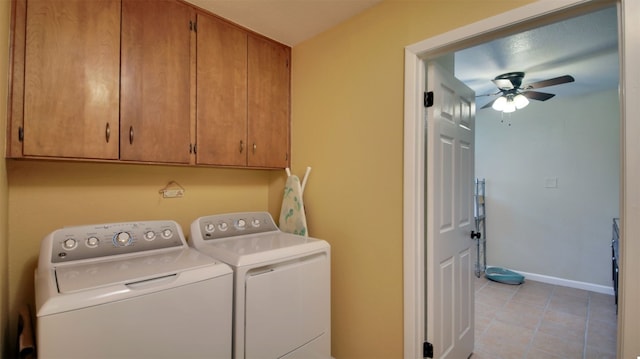 laundry area featuring separate washer and dryer, light tile patterned floors, cabinet space, baseboards, and a ceiling fan