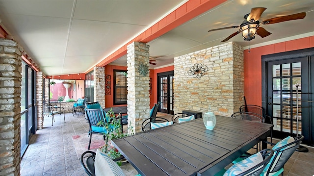 view of patio / terrace with covered porch, ceiling fan, and outdoor dining space