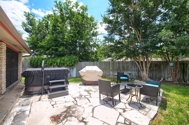 view of patio / terrace featuring a fire pit and a fenced backyard