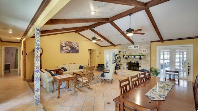 dining room featuring light tile patterned floors, visible vents, lofted ceiling with beams, and a ceiling fan
