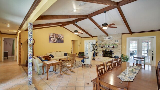 3005 Crystal Cir, Taylor, TX 76574 - dining area featuring a ceiling fan, light tile patterned flooring, a large fireplace, and baseboards
