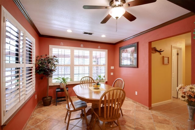 3005 Crystal Cir, Taylor, TX 76574 - dining room featuring crown molding, a ceiling fan, baseboards, and recessed lighting