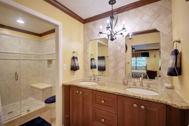 full bath featuring a sink, crown molding, a stall shower, double vanity, and ensuite bathroom