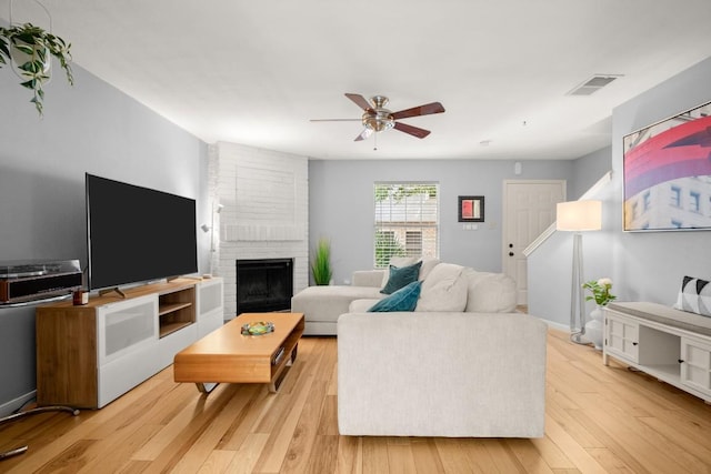 1904 Goodrich Ave Unit 16, Austin, TX 78704 - living area with a ceiling fan, wood finished floors, and a fireplace