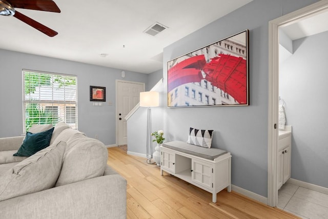 1904 Goodrich Ave Unit 16, Austin, TX 78704 - living room featuring ceiling fan, baseboards, and light wood finished floors