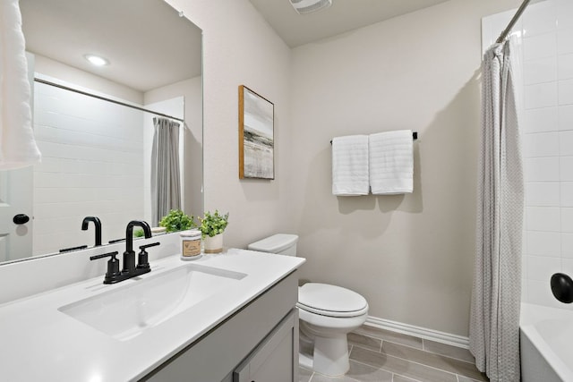 135 Hackberry Ln, Bastrop, TX 78602 - bathroom with vanity, shower / bath combo with shower curtain, toilet, visible vents, and baseboards