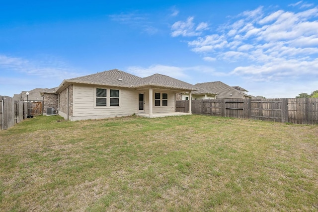 135 Hackberry Ln, Bastrop, TX 78602 - rear view of property with a patio, a yard, and a fenced backyard