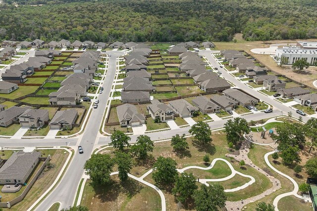 135 Hackberry Ln, Bastrop, TX 78602 - aerial overview of property's location featuring nearby suburban area and a heavily wooded area