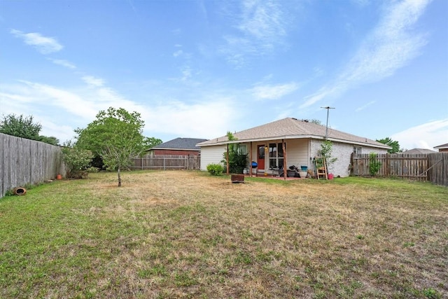 1516 Gunnison Cv, Lockhart, TX 78644 - back of property featuring a patio