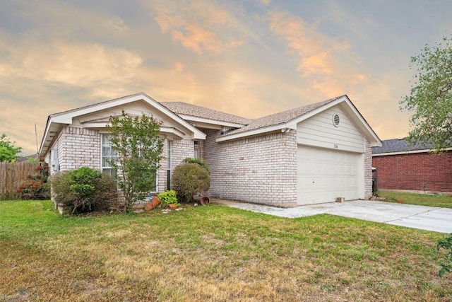 1516 Gunnison Cv, Lockhart, TX 78644 - ranch-style house with an attached garage, concrete driveway, and brick siding