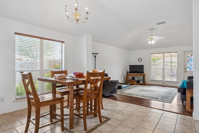 1516 Gunnison Cv, Lockhart, TX 78644 - dining area with lofted ceiling, a chandelier, ceiling fan, and light tile patterned floors