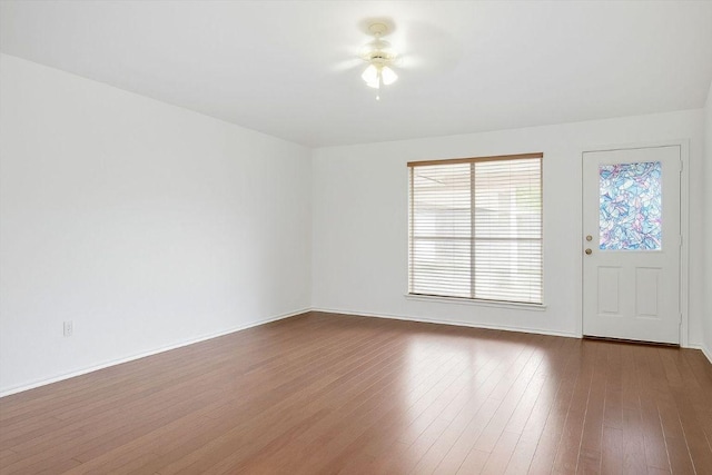 1516 Gunnison Cv, Lockhart, TX 78644 - unfurnished room featuring dark wood finished floors and baseboards