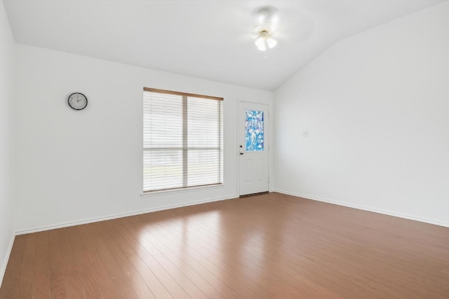 1516 Gunnison Cv, Lockhart, TX 78644 - spare room featuring vaulted ceiling, wood finished floors, baseboards, and a ceiling fan
