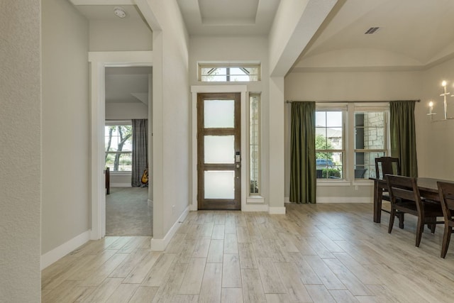 2724 Rain Song Dr, Leander, TX 78641 - foyer featuring light wood-type flooring and a chandelier