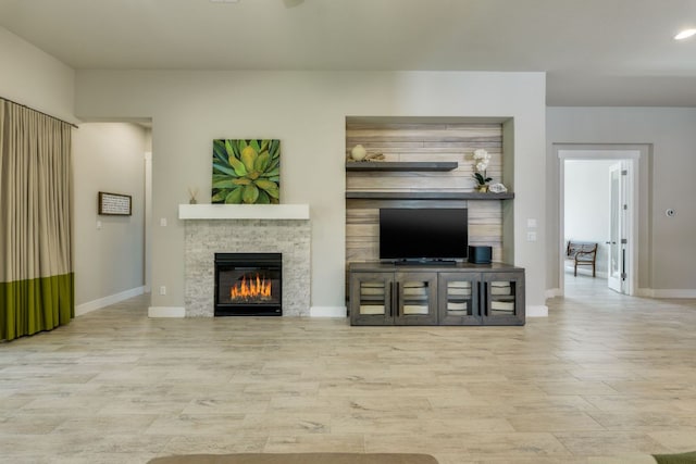 2724 Rain Song Dr, Leander, TX 78641 - living room featuring a fireplace and wood finished floors
