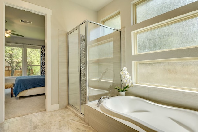 2724 Rain Song Dr, Leander, TX 78641 - full bathroom featuring a shower stall, a garden tub, a ceiling fan, and ensuite bathroom