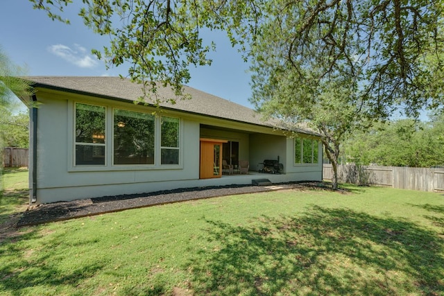2724 Rain Song Dr, Leander, TX 78641 - back of property featuring stucco siding and a patio area