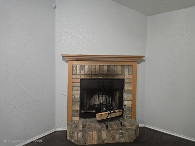 interior details featuring a brick fireplace, carpet floors, and baseboards