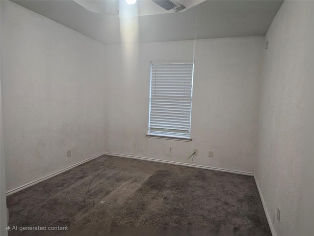 empty room with baseboards, a ceiling fan, and carpet floors