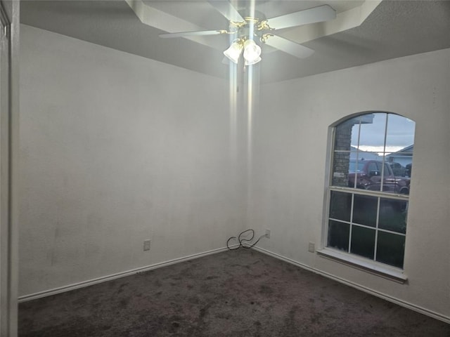 empty room featuring ceiling fan and carpet floors