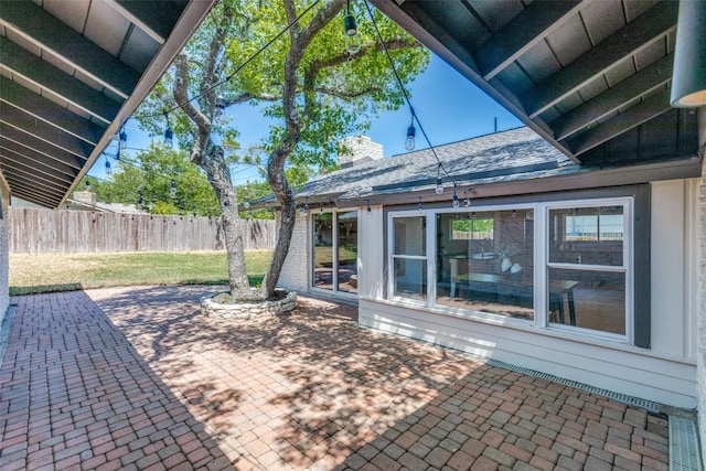 view of patio / terrace featuring fence