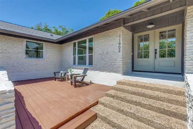 wooden deck featuring french doors