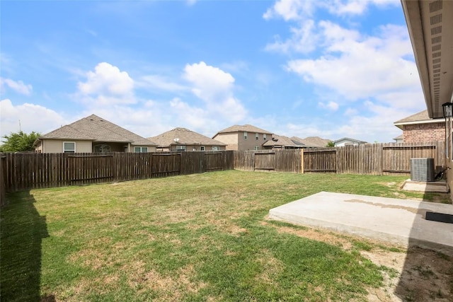 view of yard with central AC, a patio, a residential view, and a fenced backyard
