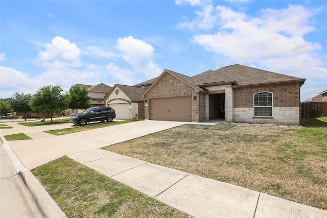 view of front of home with driveway, a shingled roof, an attached garage, brick siding, and a front lawn
