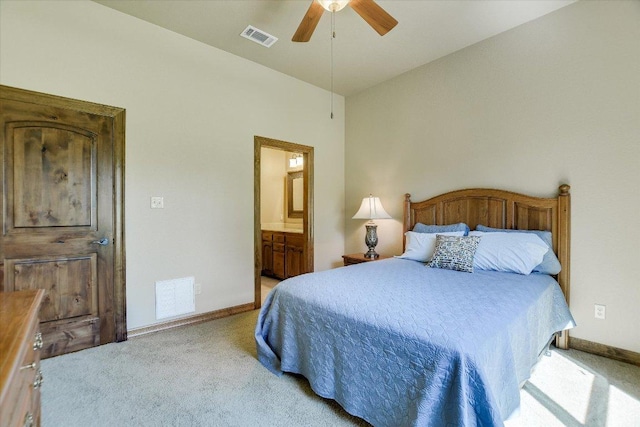 bedroom with baseboards, visible vents, and light colored carpet
