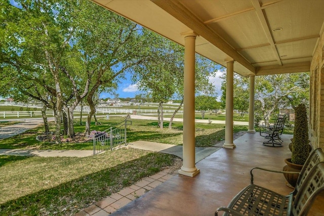 view of patio featuring fence