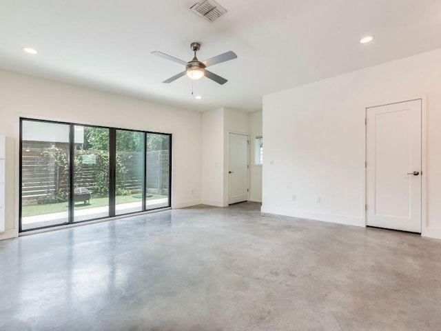 spare room featuring recessed lighting, concrete floors, baseboards, visible vents, and a ceiling fan