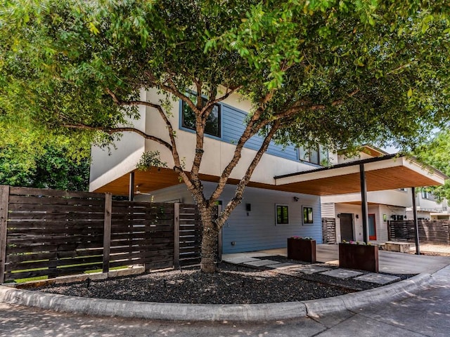 view of front of home featuring fence