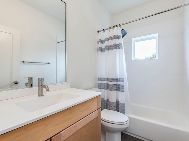 bathroom featuring shower / tub combo, vanity, and toilet