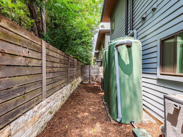 view of side of home featuring a fenced backyard