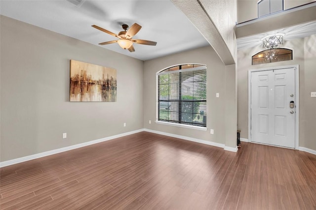 3306 Castleton Dr, Killeen, TX 76542 - entryway featuring dark wood-type flooring, a ceiling fan, arched walkways, and baseboards