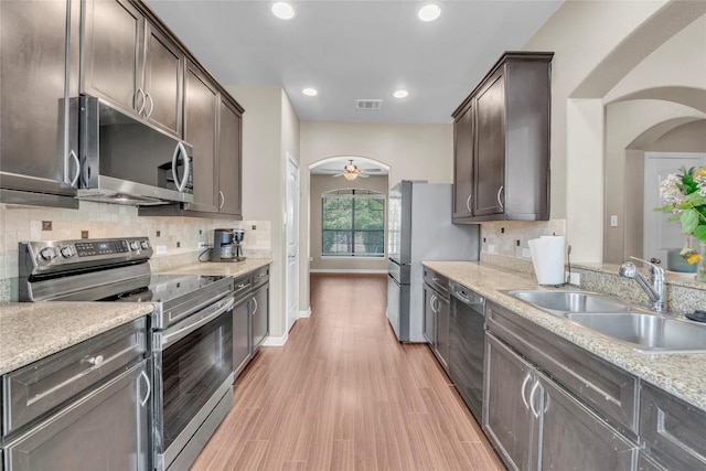 3306 Castleton Dr, Killeen, TX 76542 - kitchen featuring a sink, visible vents, stainless steel appliances, and arched walkways