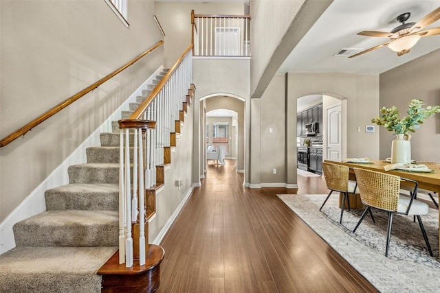 3306 Castleton Dr, Killeen, TX 76542 - entryway with arched walkways, ceiling fan, hardwood / wood-style floors, and stairway