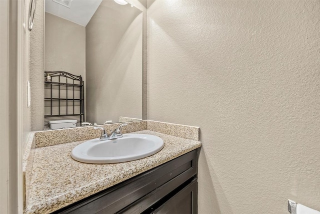 3306 Castleton Dr, Killeen, TX 76542 - bathroom featuring a textured wall and vanity