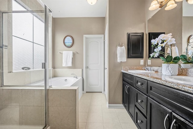 3306 Castleton Dr, Killeen, TX 76542 - bathroom with double vanity, a garden tub, healthy amount of natural light, and tile patterned floors
