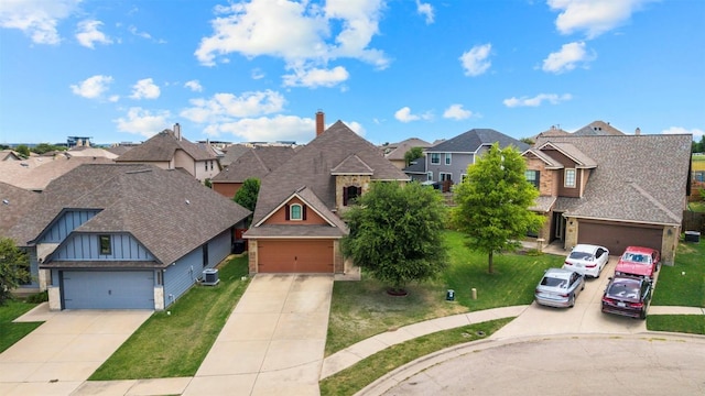 3306 Castleton Dr, Killeen, TX 76542 - view of front of property featuring a residential view, board and batten siding, a front yard, a garage, and a shingled roof