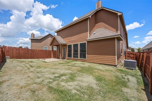 3306 Castleton Dr, Killeen, TX 76542 - rear view of property with a fenced backyard, a patio, a shingled roof, and a chimney